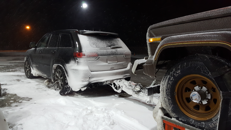 Illustration for article titled Towing An Old Jeep Through An Ice Storm With A 707 HP Jeep Grand Cherokee Trackhawk Was Truly Terrifying